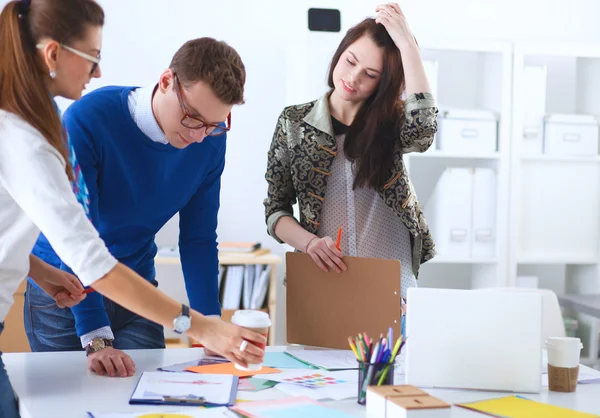 Young business people working at office on new project