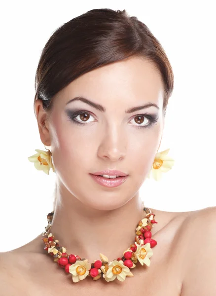 Portrait of young beautiful brunette woman in beads Royalty Free Stock Images