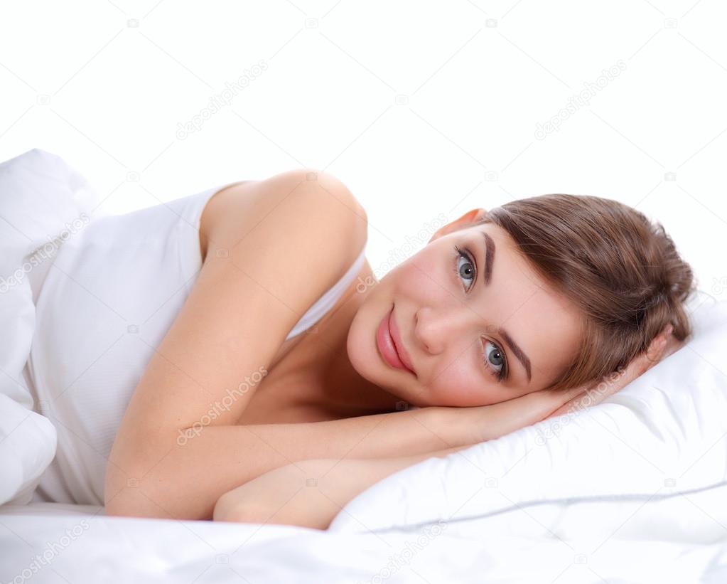 Beautiful girl lying in bedroom at early morning