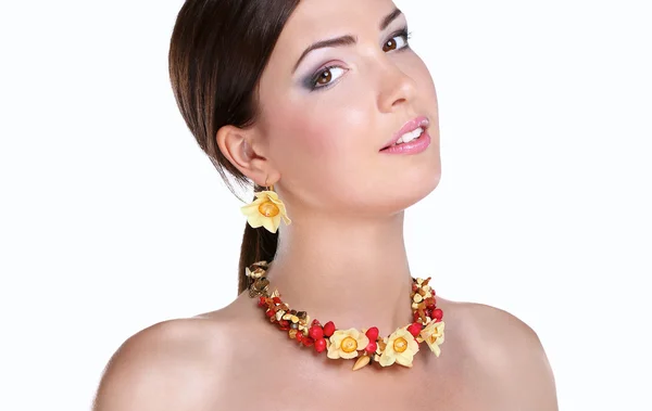 Portrait of young beautiful brunette woman in beads — Stock Photo, Image