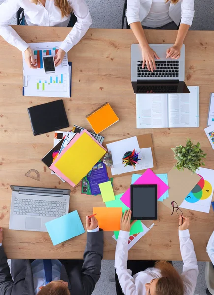 Business people sitting and discussing at business meeting, in office — Stock Photo, Image