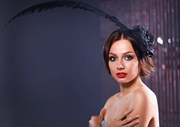 Portrait of beautiful young woman face. Isolated on dark background — Stock Photo, Image