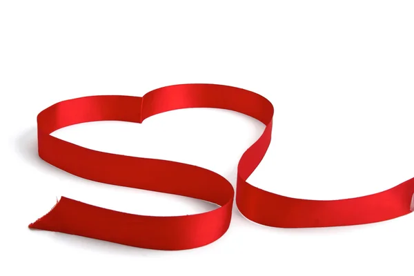 A red ribbon shaping heart , isolated on white background — Stock Photo, Image