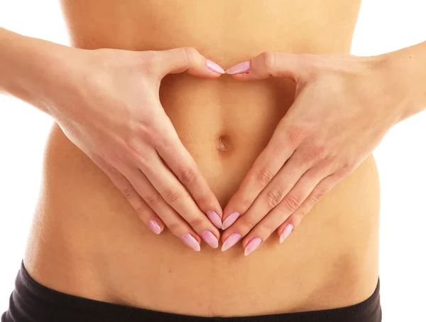 Mulher formando forma de coração na barriga — Fotografia de Stock