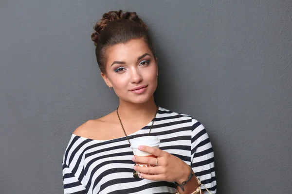 Portrait of  young woman with cup  tea or coffee — Stock Photo, Image