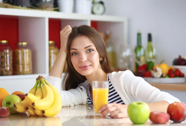 Portrait of a pretty woman holding glass with tasty juice — Stock Photo, Image