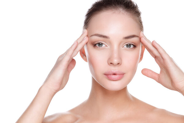 Beautiful healthy woman touching her skin