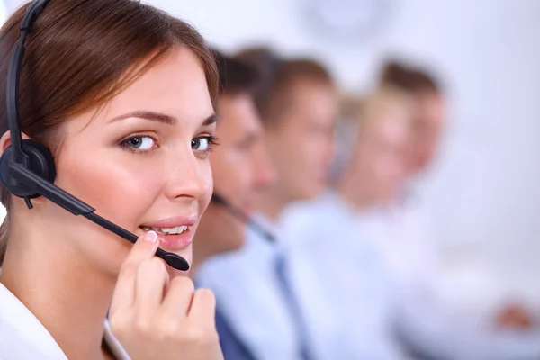 Attractive Smiling positive young businesspeople and colleagues in a call center office — Stock Photo, Image