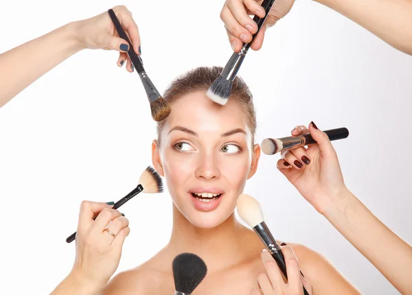 Closeup portrait picture of beautiful woman with brushes — Stock Photo, Image