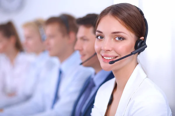 Attractive Smiling positive young businesspeople and colleagues in a call center office — Stock Photo, Image