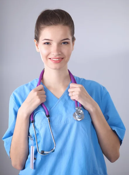 Portrait of happy successful young female doctor holding a stethoscope Royalty Free Stock Images