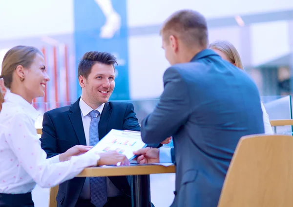 Group of happy young business people in a meeting at office — Stock Photo, Image