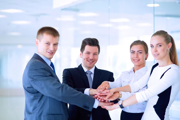 Business people with their hands together in a circle Royalty Free Stock Images