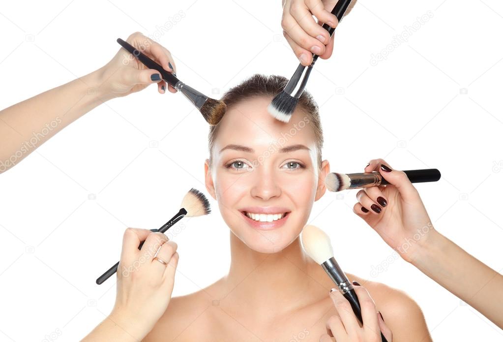 Closeup portrait picture of beautiful woman with brushes