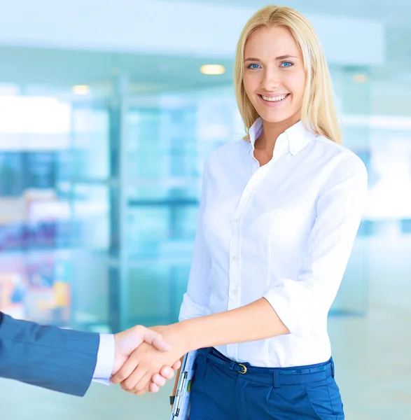 Two successful business people shaking hands with each other — Stock Photo, Image