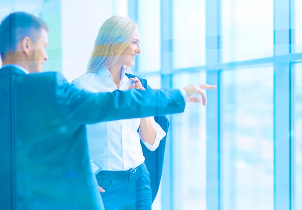 Smiling successful business team standing in office — Stock Photo, Image