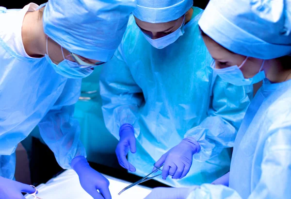 Team surgeon at work in operating room. — Stock Photo, Image
