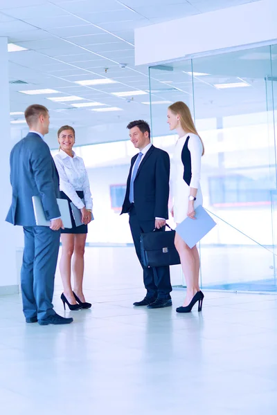 Smiling successful business team standing in office — Stock Photo, Image