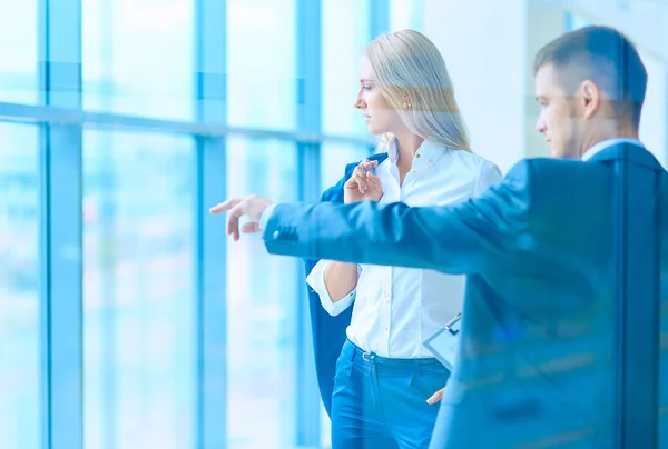 Smiling successful business team standing in office — Stock Photo, Image