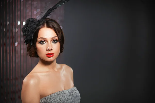 Portrait of beautiful young woman face. Isolated on dark background — Stock Photo, Image