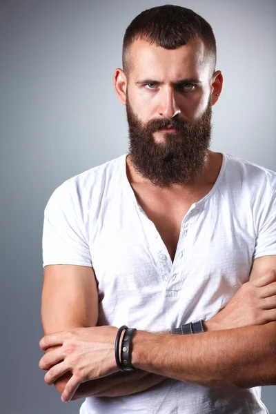 Portrait of handsome man standing, isolated on grey background — Stock Photo, Image