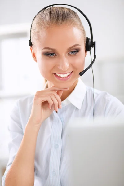 Close-up portrait of a customer service agent sitting at office — Stock Photo, Image