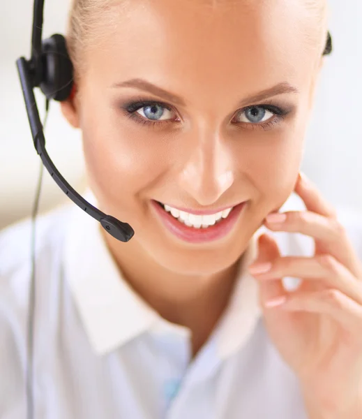 Close-up portrait of a customer service agent sitting at office — Stock Photo, Image