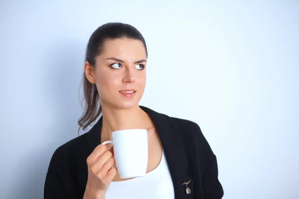 Portrait of  young woman with cup  tea or coffee — Stock Photo, Image