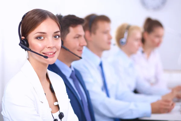 Attractive Smiling positive young businesspeople and colleagues in a call center office — Stock Photo, Image