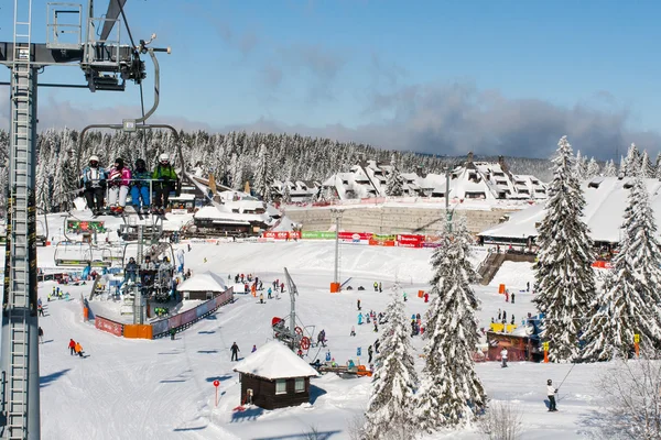 Ski resort Kopaonik, Serbia, people on the ski lift, mountains panorama