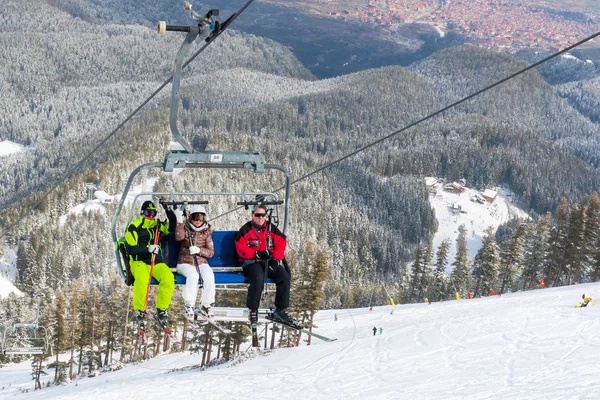 Ski resort Bansko, Bulgaria aerial view, skiers on lift