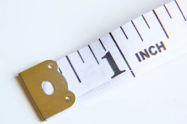 Close up on a tape measure one inch — Stock Photo, Image