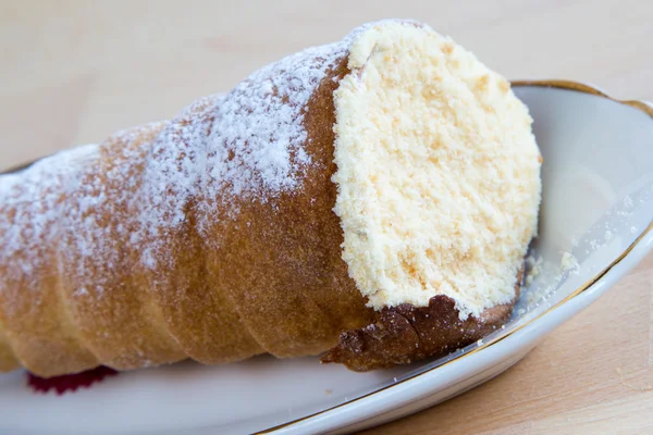 Cake tube cone covered with sugar powder — Stock Photo, Image