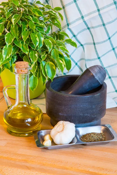 Bottle of olive oil, mortar and pestle — Stock Photo, Image