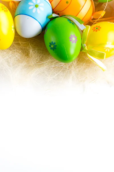 Green grass box with Easter eggs on white  background — Stock Photo, Image