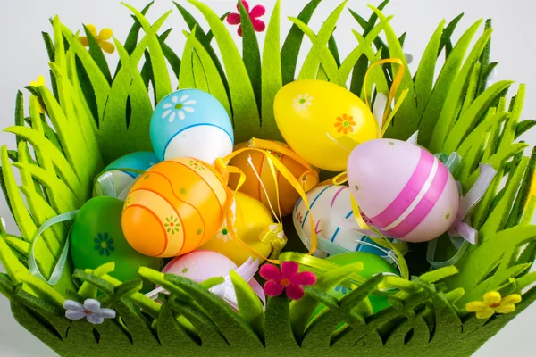 Green grass box with Easter eggs — Stock Photo, Image