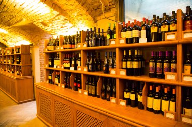 Wine bottles in authentic Italian wine cellar interior