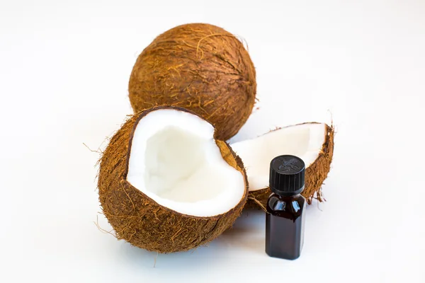 Fresh coconut and oil for alternative therapy — Stock Photo, Image