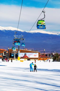 Bansko cable car cabin and snow peaks, Bulgaria clipart