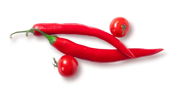 Two chili pepper and two cherry tomatoes top view — Stock Photo, Image