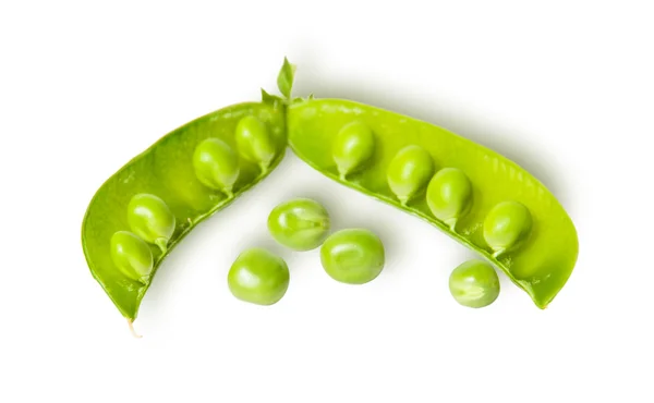 Opened green pea pod and several peas — Stockfoto