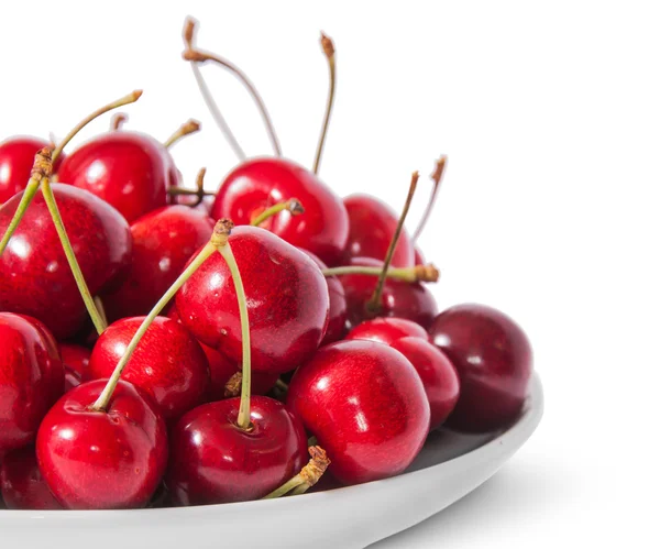 Closeup red sweet cherries in white plate — ストック写真