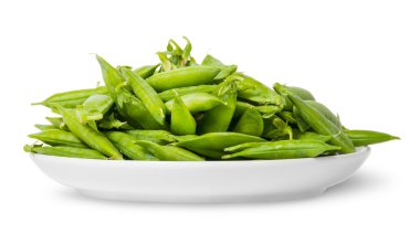 Pile of green peas in pods on white plate