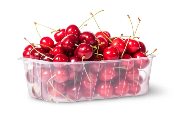 Red juicy sweet cherries in a plastic tray rotated — Stock Photo, Image