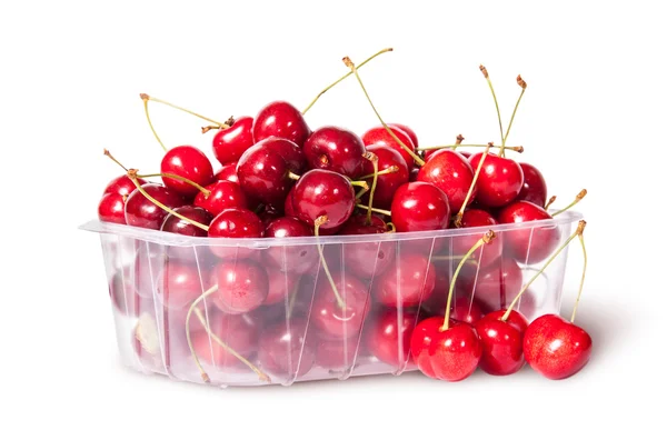 Red sweet cherries in plastic tray rotated and three near — Stock Photo, Image