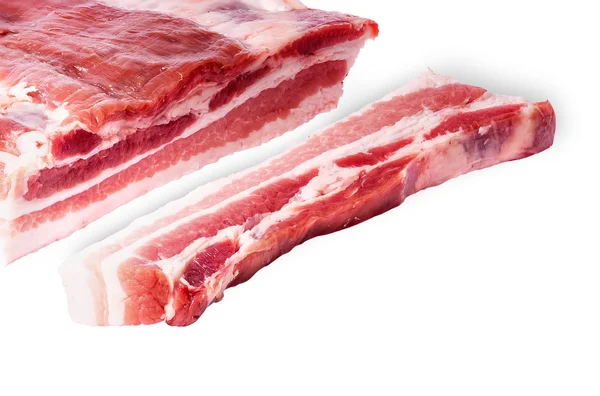 Cut a piece of bacon next to a large — Stock Photo, Image