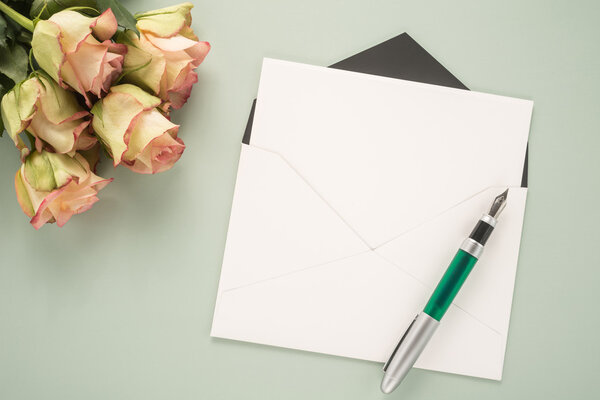 Flowers, envelope and pen