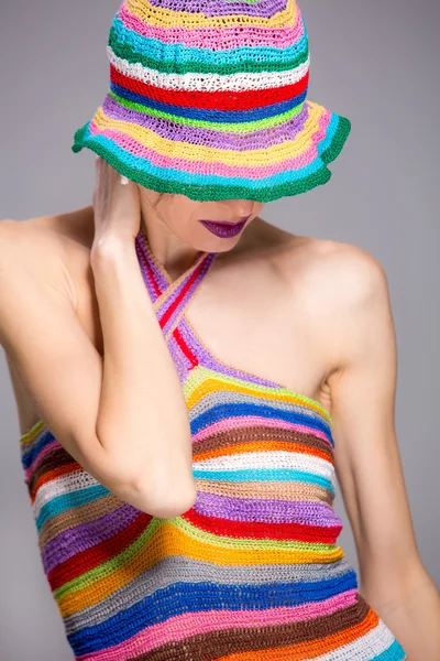 Elegant summer woman in stripes hat and dress — Stock Photo, Image