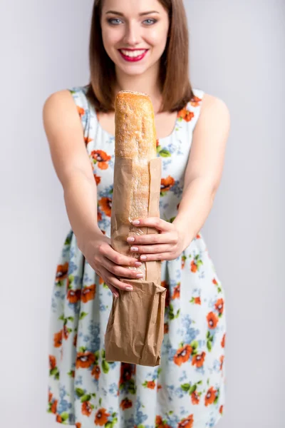 Portrait of beautiful girl with a bread — Stock Photo, Image