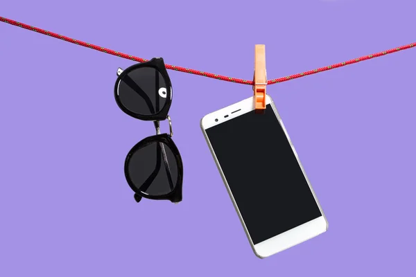 Sunglasses and mobile phone — Stock Photo, Image